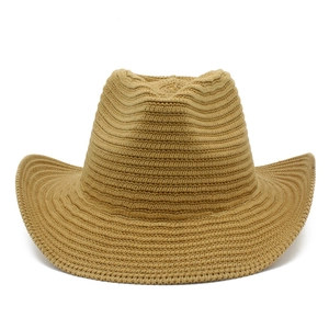 Khaki woven straw cowboy hat with wide upturned brim and classic indented crown for summer