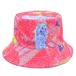 Detail of the tie-dye bucket hat showing vibrant stitching on the colorful brim