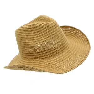 Close-up of high-quality light brown woven texture on a jazz hat with a wide wavy brim