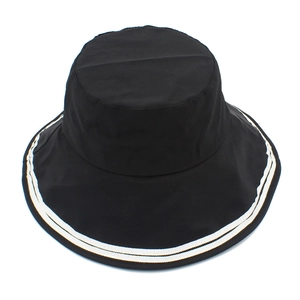 Top-down view of black wide-brim bucket hat with two white decorative stripes