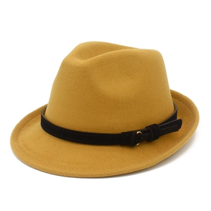 Detail view of ginger wool fedora hat with black suede band and golden buckle