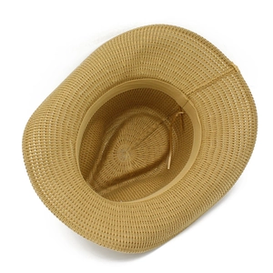 Close-up of a straw sun hat showing breathable weave and internal adjustable sweatband