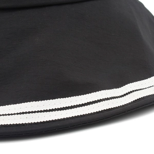Detailed close-up of black cotton sun hat showing dual white stripes on the brim