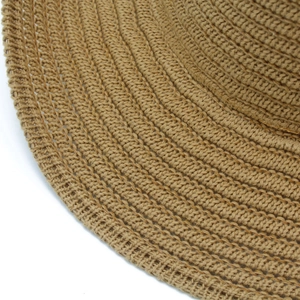Close-up of khaki knitted fedora showing detailed hand-woven texture and craftsmanship