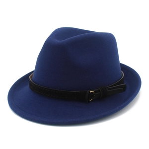 Close-up of wool felt jazz hat in royal blue with black band and gold buckle detail