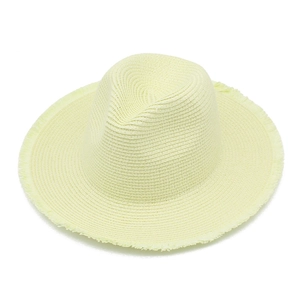 Detail of hand-woven straw hat brim with fringe edge and sun protection texture