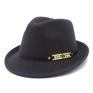 Close-up of charcoal wool fedora featuring a black leather band and crystal gold buckle