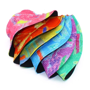 Detail showing five reversible bucket hats with colorful abstract watercolor patterns