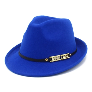 Close-up of royal blue wool fedora hat featuring a black band and gold buckle detail