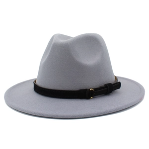Detail of light gray wool felt fedora with black suede band and golden metal buckle