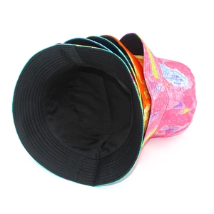 Detail of multi-colored tie-dye bucket hats with durable stitching and black cotton lining