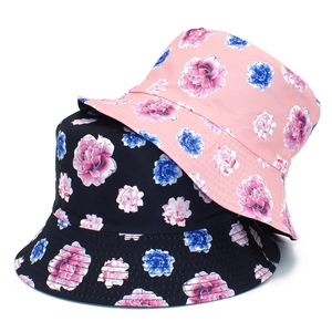 Floral reversible bucket hat featuring pink and blue peony print for sun protection
