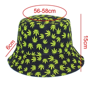 Detail view of black bucket hat with neon green leaf prints and 56-58cm size measurements