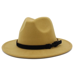 Close-up of fedora hat with black matte band and gold buckle on camel wool felt fabric