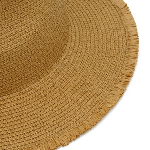Close-up of natural brown raffia straw hat showing tight spiral weave and frayed fringe edges