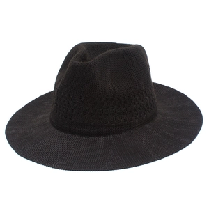 Detail of hand-woven black fedora hat showing breathable knit texture and decorative band