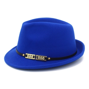 Detail of royal blue wool fedora hat featuring black leather band and gold metal buckles