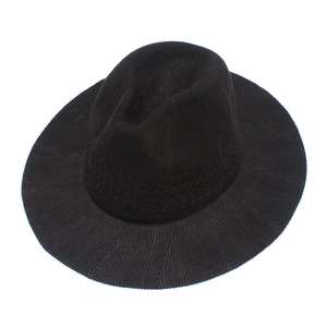 Close-up of black breathable hand-woven fedora hat with a classic textured knit surface