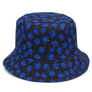 Detailed view of bucket hat with blue maple leaf print on black canvas fabric