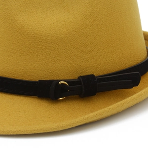 Detailed macro view of ginger yellow wool felt fedora with black belt and gold buckle