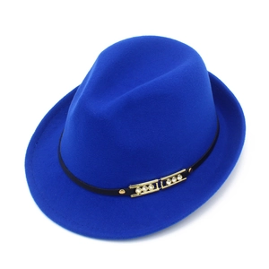 Close-up of royal blue wool fedora hat featuring black band with gold rhinestone buckle