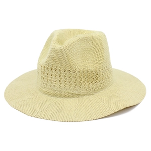 Detail of hand-woven breathable sun hat featuring hollow decorative band and wide brim