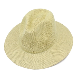 Detail of hand-woven breathable straw hat with decorative openwork and wide brim