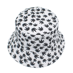 Detailed top view of white bucket hat featuring all-over black maple leaf print pattern