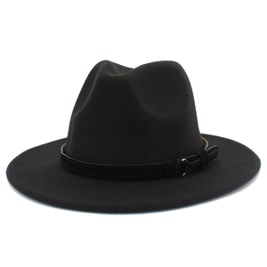 Detail of black wool fedora hat featuring a matte band and gold metallic buckle