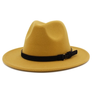 Detail of a ginger yellow fedora hat with a black belt and golden ring buckle decoration