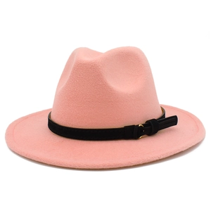 Detail of pink wool fedora hat featuring a black decorative band and golden buckle