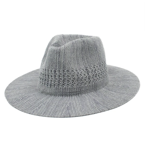 Detailed view of grey hand-woven breathable sun hat with hollow decorative pattern band