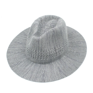 Detail view of silver foldable fedora showing breathable knit texture and wide brim