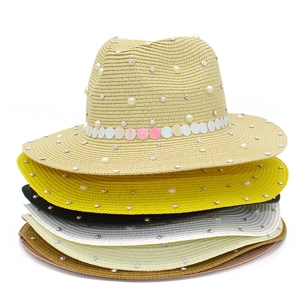 Stacked collection of pearl-decorated straw fedora hats in various vibrant summer colors