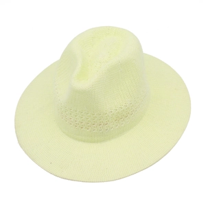 Detailed view of lightweight straw fedora hat featuring breathable hollow knit patterns