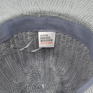 Detail shot of internal sweatband and material care label on soft breathable sun hat