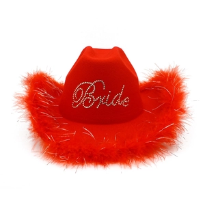 Detailed view of red cowboy hat with fluffy feather trim and rhinestone Bride lettering