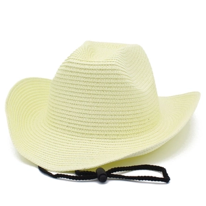 Detailed texture of beige woven straw cowboy hat with adjustable black wind lanyard