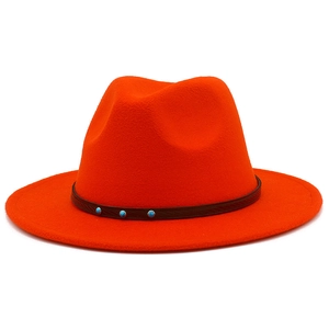 Close-up of bright orange felt fedora featuring a decorative band with turquoise studs