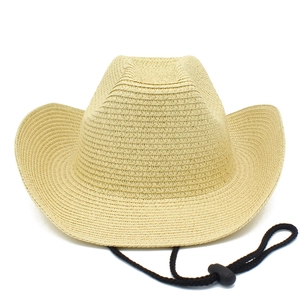 Detail of hand-woven straw cowboy hat texture with adjustable black windproof chin strap