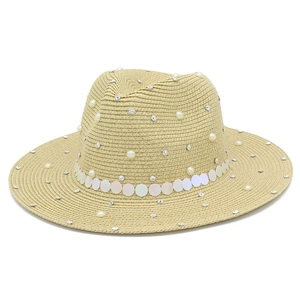 Detail of light beige straw fedora hat featuring pearls, rhinestones and iridescent sequins
