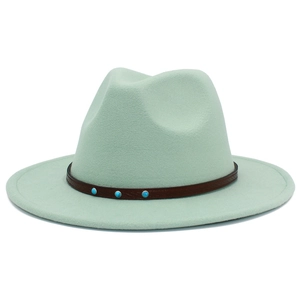 Macro shot of mint green fedora hat with brown leather band and turquoise studs