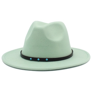Detail of mint green fedora hat featuring a brown leather band and turquoise beads decoration