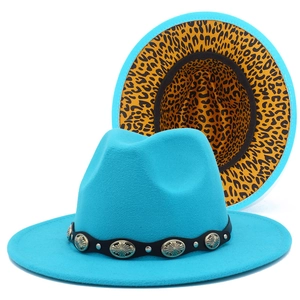 Detail of turquoise fedora hat with silver studs and leopard print inner brim