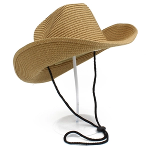 Detail of adjustable black windproof chin strap on a foldable western straw cowboy hat