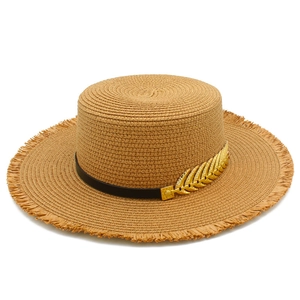 Summer straw boater hat with frayed edges, black ribbon, and gold leaf detail