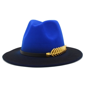 Detailed close-up of blue gradient fedora hat featuring a gold leaf metal accessory