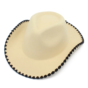 Detail view of beige wool felt fedora with black stitched edge and Western cowboy crown