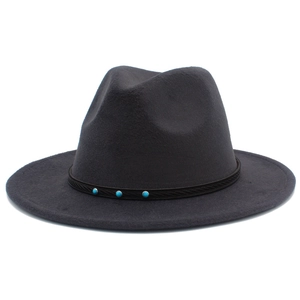 Detailed close-up of a dark grey wool fedora hat with a decorative blue turquoise band