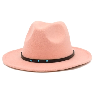 Detail of pink fedora felt hat showing black leather strap with turquoise style studs